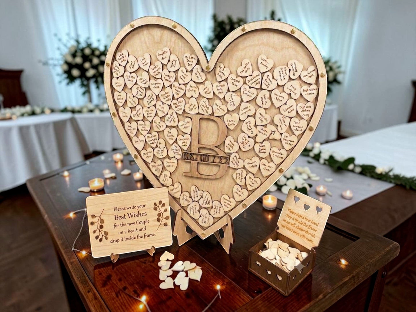 Freak of Laser heart-shaped wooden wedding guest book  with personalized monogram and plain wooden hearts.