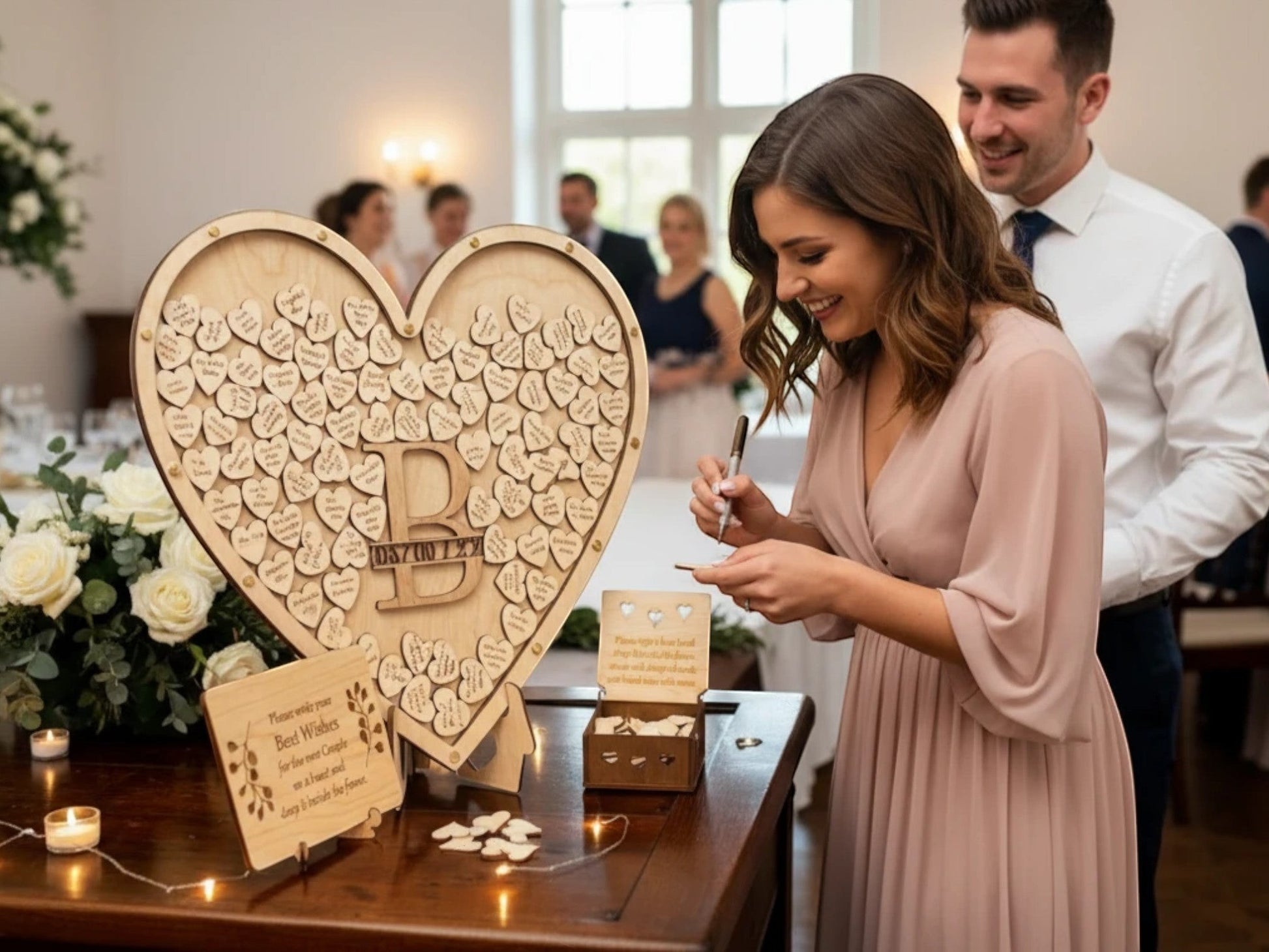 Freak of Laser heart drop box guest book with personalized monogram and wooden hearts at a wedding reception.