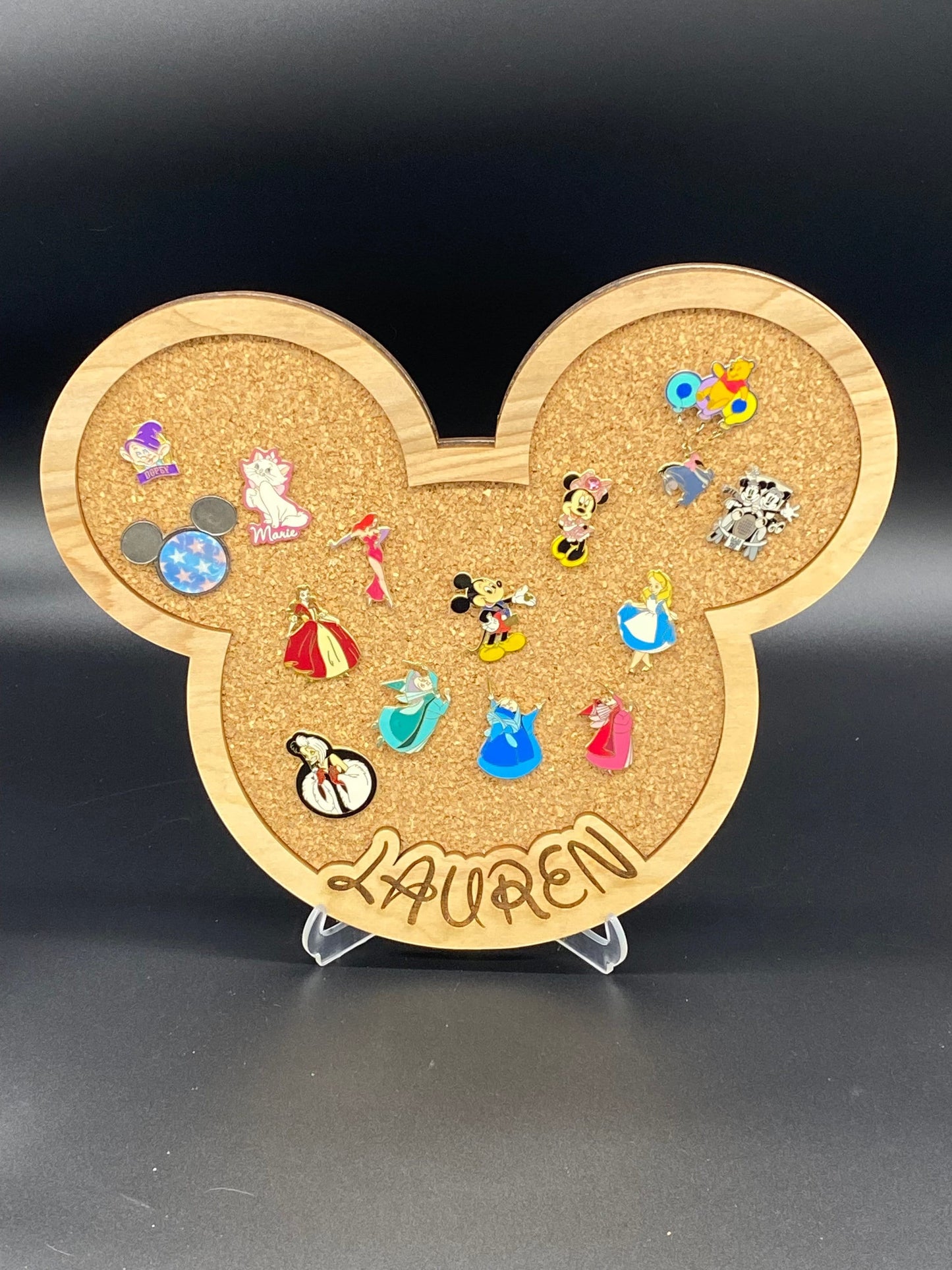 Freak of Laser personalized character-shaped cork pin display board with custom engraved name Lauren and enamel pins.